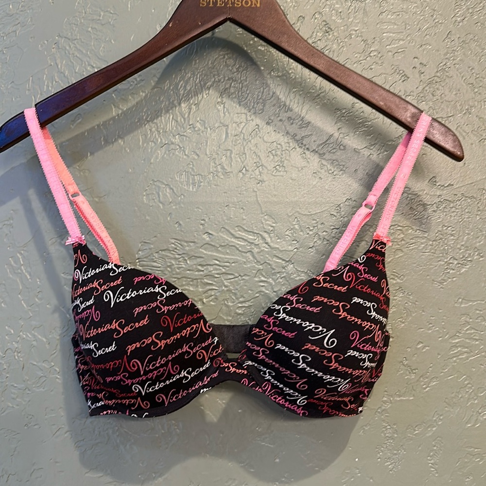 Victoria Secret bra. Black with pink white & red text, matching panty
